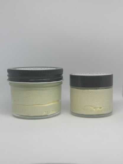 Two glass jars of whipped shea butter. One four ounce jar and one two ounce jar