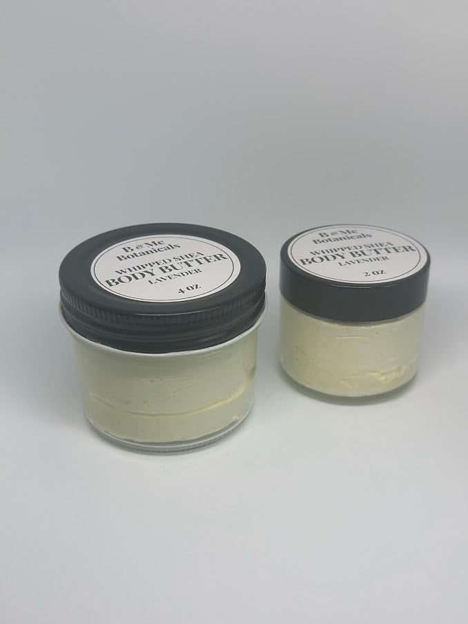 Two glass jars of whipped shea butter. One four ounce jar and one two ounce jar
